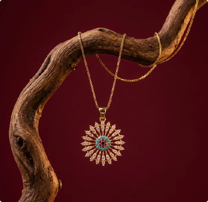 Gold necklace on wooden branch